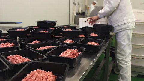 Meat processing in food industry,Packaging minced meat on the production line at the factory 