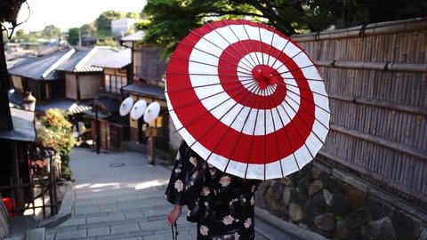 woman wearing a kimono walks in Kyoto Japan