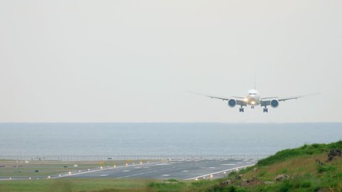 Widebody airplane approaching before landing at Phuket International airport.