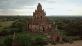 Drone shot aerial view of Bagan archeological zone with ancient temples buddhist religion in greenery landscape shot in 4K resolution October nature travel destinations concept