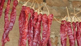Close-up footage of red chili peppers drying