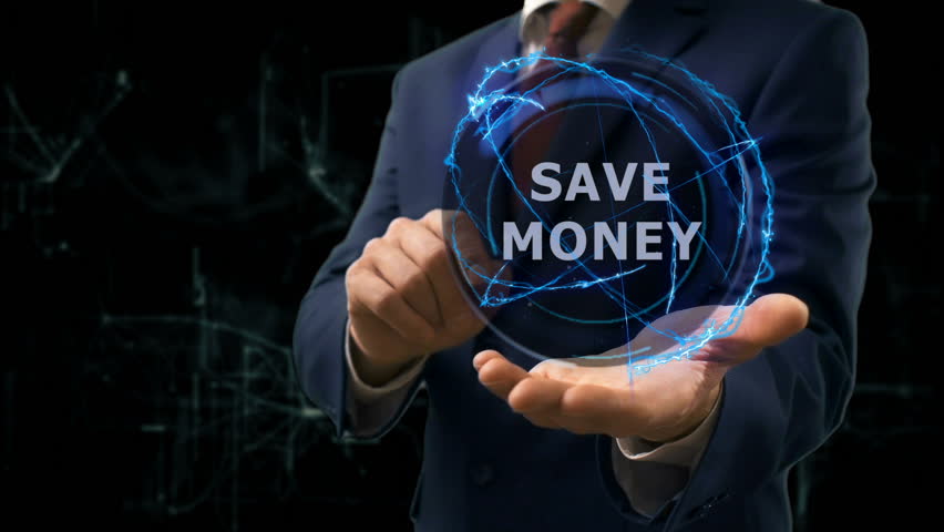 Businessman shows concept hologram Save money on his hand. Man in business suit with future technology screen and modern cosmic background | Shutterstock HD Video #1010470145