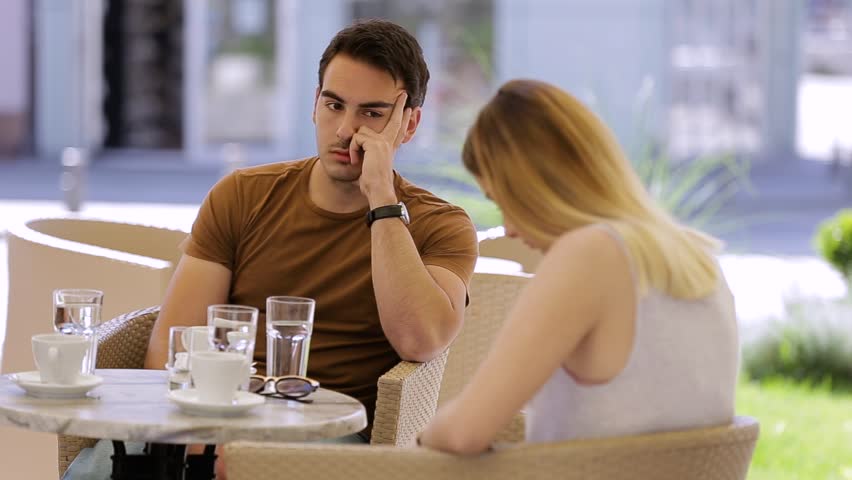Young girl typing on phone and ignoring boyfriend while sitting in cafe | Shutterstock HD Video #1010471654