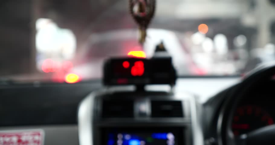 Blurred of inside the taxi,on the road and heavy traffic and rain. Royalty-Free Stock Footage #1010478074