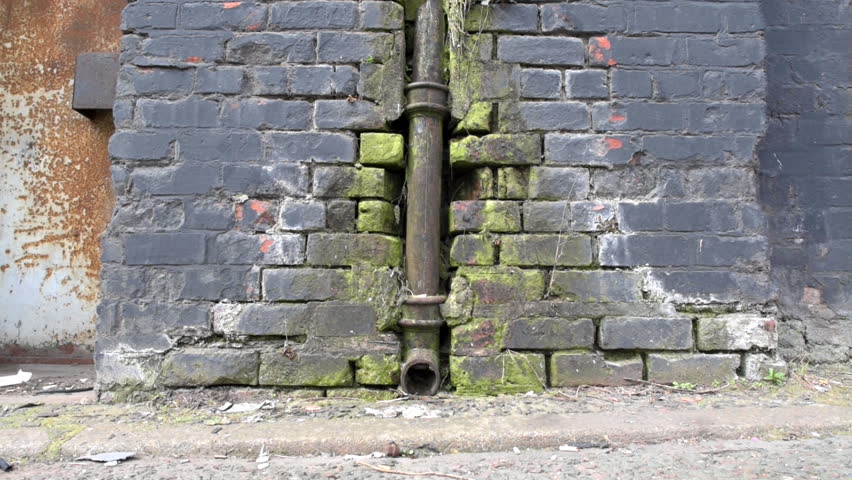 Grungy old neglected drain pipe gutter. Royalty-Free Stock Footage #1010478821