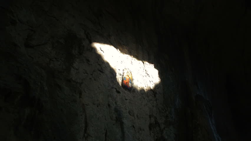 Prohodna cave also known as God's eyes near Karlukovo village, Bulgaria. Sun beams coming from the Gods eyes and lighting the cave. Royalty-Free Stock Footage #1010485049