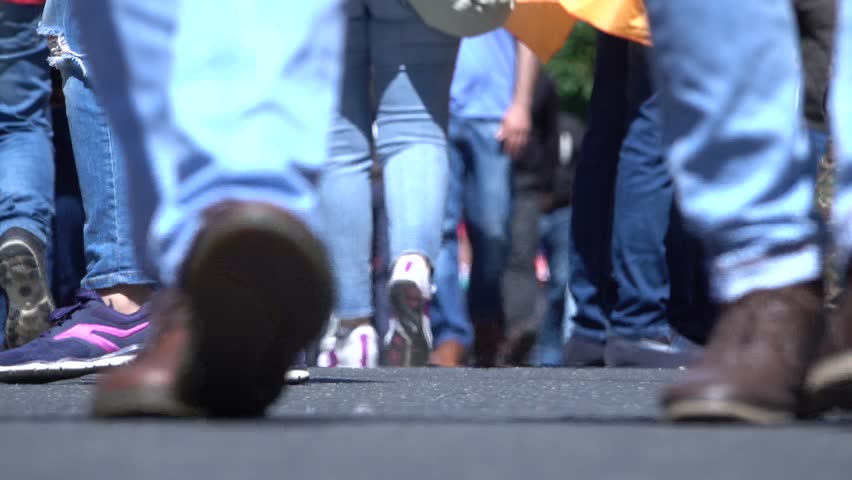  People's legs, young mans and girls ride, walk, protesters | Shutterstock HD Video #1010485109