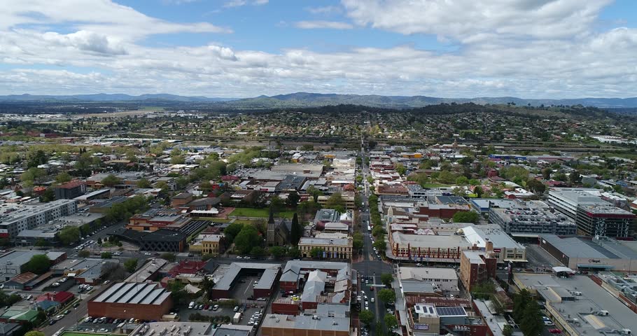 Albury downtown along main shopping street with local services and landmark buildings towards distant Hume highway and train station.
