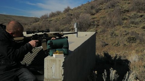 Man Training or Practicing Shooting an AR-15 Assault Rifle.