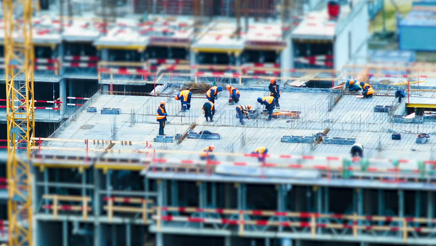 Time lapse tilt shift builders and cranes working on the construction site close up, zoom Royalty-Free Stock Footage #1010505593