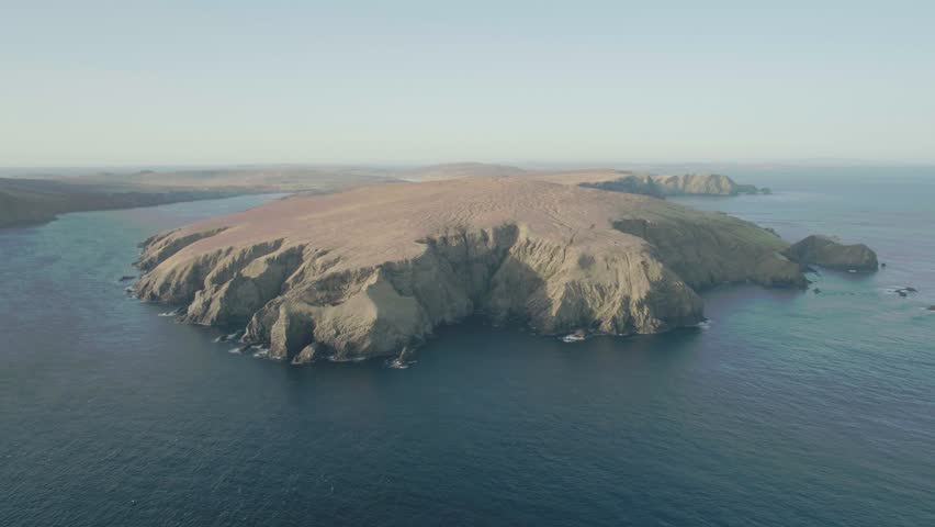 Aerial drone shot of cliffs in Unst, Shetland during a sunset Royalty-Free Stock Footage #1010511056