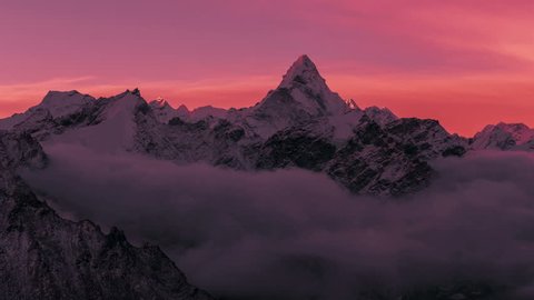 Greatness of nature concept: grandiose view of Ama Dablam peak (6812 m) at sunrise. Nepal, Himalayan mountains. Time lapse.