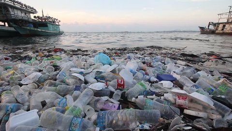 SEMPORNA, MALAYSIA - CIRCA MAY 2018: Plastic bottles and bags pollution in the ocean. Environmental pollution problem