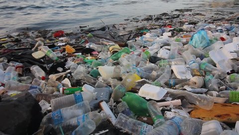 SEMPORNA, MALAYSIA - CIRCA MAY 2018: Plastic bottles and bags pollution in the ocean. Environmental pollution problem
