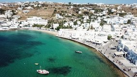Aerial drone bird's eye view video of iconic old port in chora of Mykonos island, Cyclades, Greece