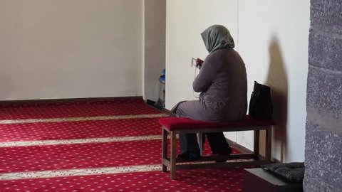 A Muslim woman worshiping in the mosque. worshiping Ramadan and religious holidays