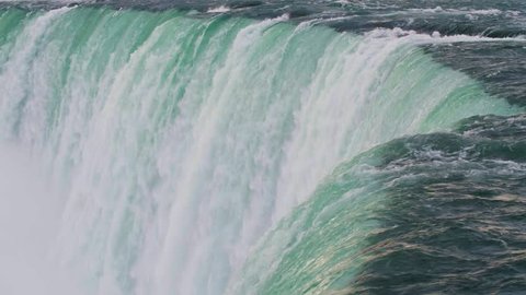 Slow Motion Bird Flying Past Waterfall at Niagara Falls, Ontario, Canada