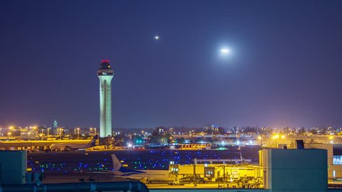 Air Traffic Night Generic Airport Timelapse with ATC Tower near Miami Florida with Flying Commercial Jet Airliners in a Vibrant Blue Sky Approaching the Runway