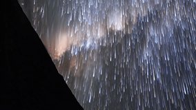 Vertical video. Traces from stars in the form of evanescent traces. Moon rise. Plateau Kara-Say (3.800 m.) Kyrgyzstan. Time Lapse