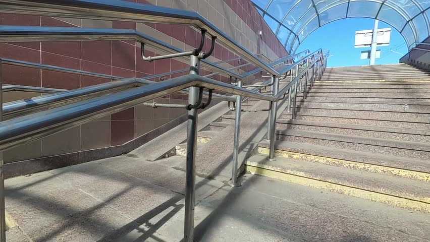 underground pedestrian crossing. barrier-free environment. metal railing. Royalty-Free Stock Footage #1010554076