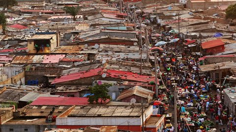 Long shot of the Lixeira (landfill) slum market at sunset in Luanda, Angola. 