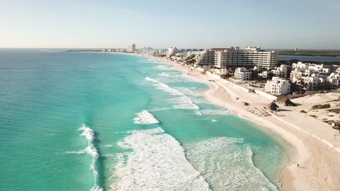 Cancun beach panorama aerial view. Aerial view of Caribbean Sea beach. Zona hotelera top view.  Beauty nature landscape with tropical beach. Caribbean seaside beach with turquoise water and big wave