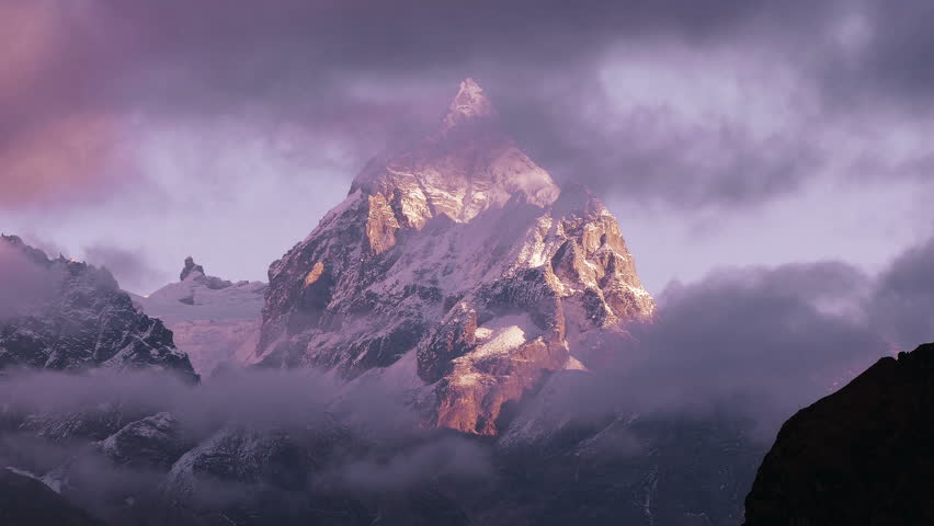 Magnificent view of Machermo peak (6273 m) at sunrise. Nepal, Himalaya mountains.  Royalty-Free Stock Footage #1010566112
