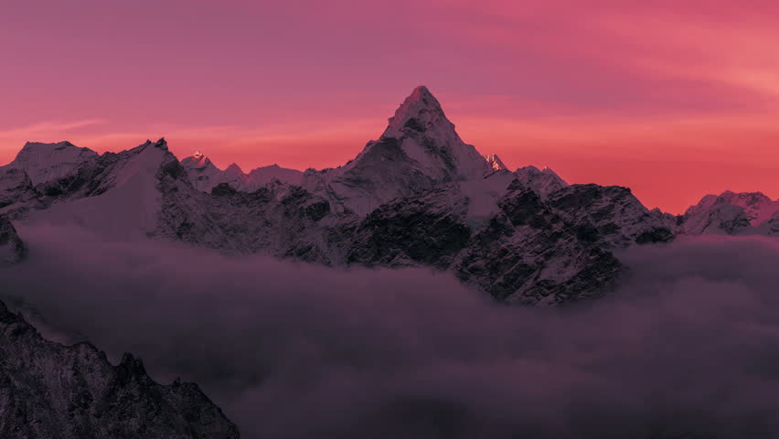 Greatness of nature: grandiose view of Ama Dablam peak (6812 m) at sunrise. Nepal, Himalayan mountains. Time lapse zoom. Royalty-Free Stock Footage #1010566118