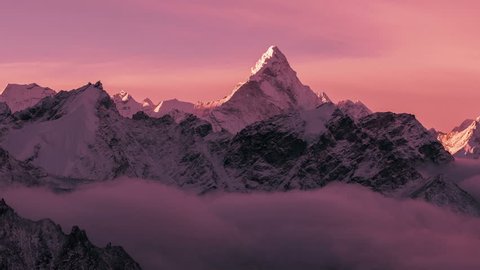 Greatness of nature: grandiose view of Ama Dablam peak (6812 m) at sunrise. Nepal, Himalayan mountains. Time lapse zoom.