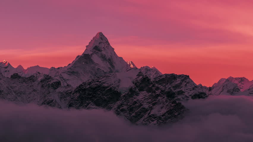 Greatness of nature cocncept: grandiose view of Ama Dablam peak (6812 m) at sunrise. Nepal, Himalayan mountains. Time lapse zoom out. Royalty-Free Stock Footage #1010566124