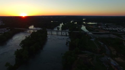 Sunset shot, slow drone flight across the Congaree River in Columbia South Carolina with a nice view of the Jarvis Klapman Bridge.