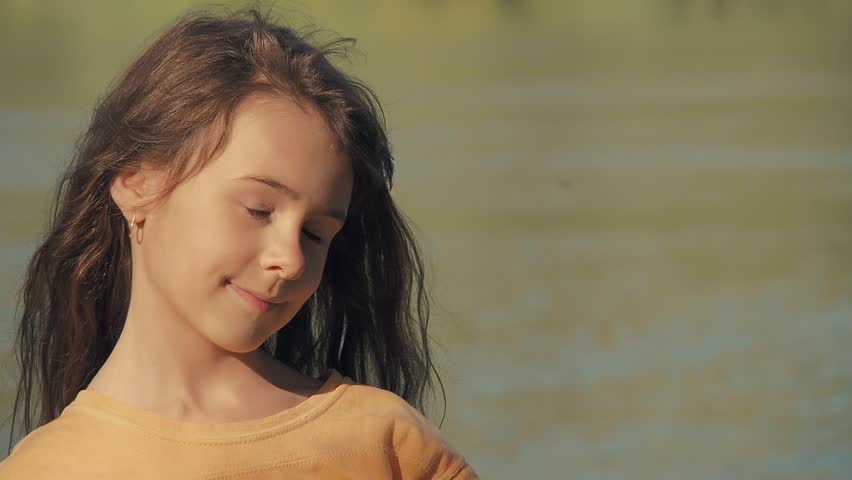 Portrait of little girl on nature.
