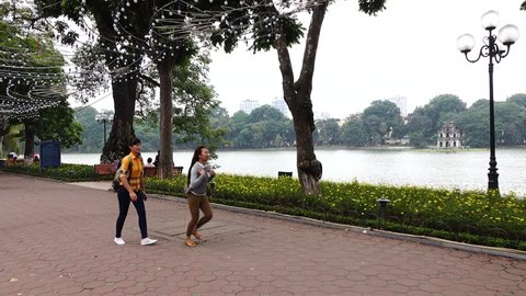 Hanoi/vietnam - May 2015: View of a daylife on a weekday in Hanoi, Vietnam. People are relaxing at Hoan Kiem lake on the morning.