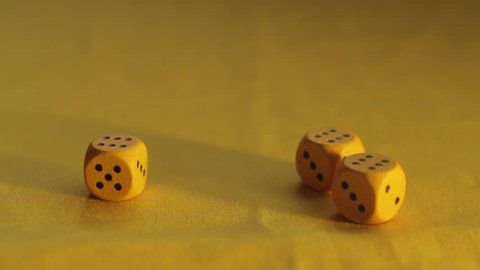 Yellow wooden chips dice. Three Dice roll