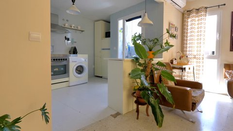 Real estate virtual tour. Camera fly-through the interior of a retro decorated home. Vintage living room and kitchen.