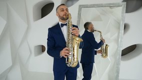Man in suit and bow tie playing saxophone near mirror