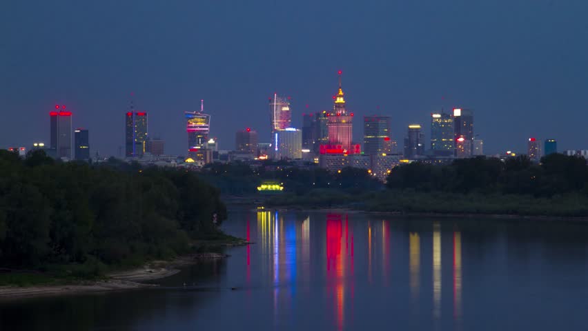 Amazing view to the centrum of Warsaw from the river Vistula. Summer evening with beautiful sunset and storm clouds.   Day to night timelapse 4k | Shutterstock HD Video #1010604161