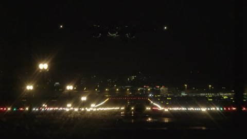 Landing Airplane Jet Flying in Dark Night Sky