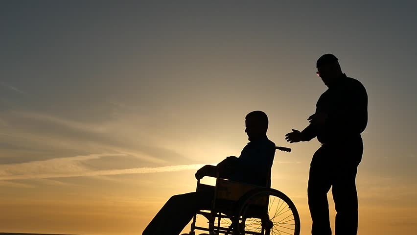 hypnosis session for man in wheelchair silhouettes on sky background slow motion Royalty-Free Stock Footage #1010626607