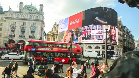 LONDON- MAY, 2018: Timelape of   Piccadilly Circus fountain and giant new advertising screen, a famous London landmark and busy destination for shoppers and tourists