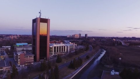 Drone shot of Dunton Towers reflecting the sunset. Carleton University, Ottawa.