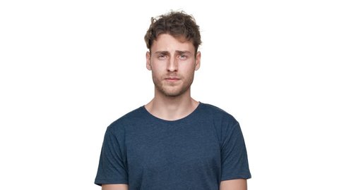 Portrait of caucasian man with awful expressions on face pinching nose due to bad disgusting smell, isolated over white background. Concept of emotions