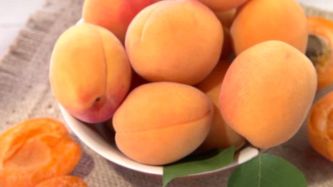 Apricot. Ripe organic apricots in a bowi rotates 360 loop-able.  High speed camera shot. Full HD 1080p.