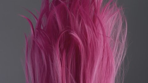 Closeup of pink hair creative colored texture slow motion from 60fps. lowed in air hair