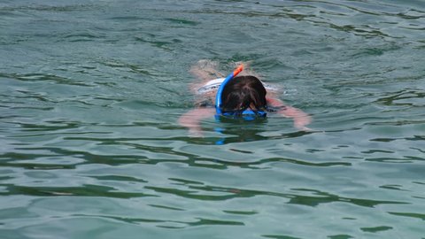 Young woman snorkeling near the Similan Islands