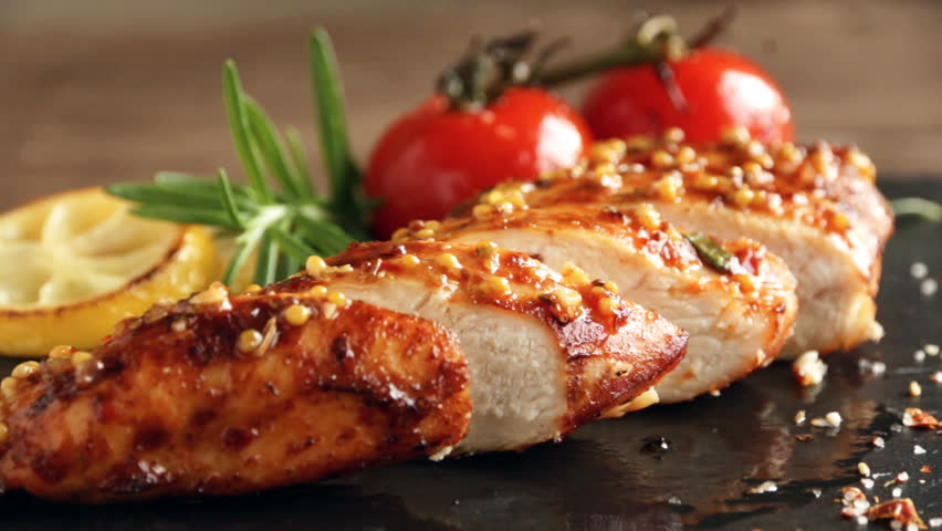 cooking fried roasted chicken breasts cut knife. lemon tomato and rosemary mustard seeds honey Royalty-Free Stock Footage #1010683757