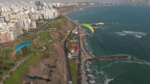 MIRAFLORES, LIMA, PERU: Paraglides and the city as background.