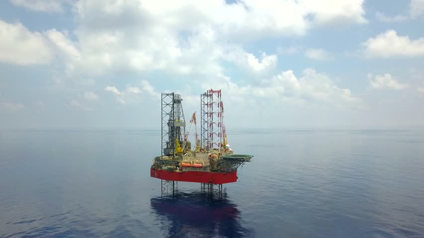 KELANTAN, MALAYSIA - APRIL 23, 2018: An offshore jack-up drilling rig in Malaysian Waters. | Shutterstock HD Video #1010689973