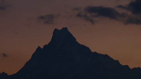 Annapurna base camp trek, Time lapse of view on the summit of the mountain Machapuchare (fish tail) at sunrise in Nepal.
