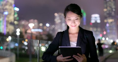 Business woman work on tablet in the city of Hong Kong